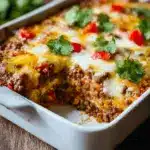 Once fully combined, transfer the mixture to the prepared baking dish, spreading it evenly Recipe