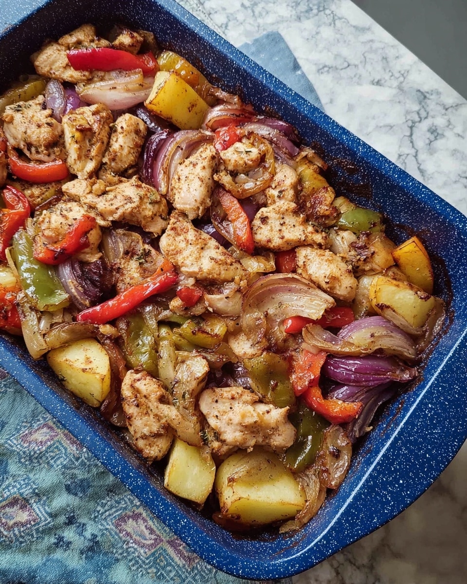 A rectangular dark blue baking tray holds a dish with multiple layers, placed on a white marbled textured tablecloth with colorful patterns. The first layer is a mix of roughly cut vegetables in different colors and textures, such as red tomatoes, green bell peppers, and light yellow potatoes, scattered unevenly across the tray. On top of this vegetable mix, there is a layer of browned chicken pieces that have a cooked, slightly crispy texture with some spices visible, giving a light golden to beige color. The colors blend naturally with some juices and oils creating a slight shine on the surface. The edges of the tray have some roasted bits, enhancing the rustic look of the dish. photo taken with an iphone --ar 4:5 --v 7