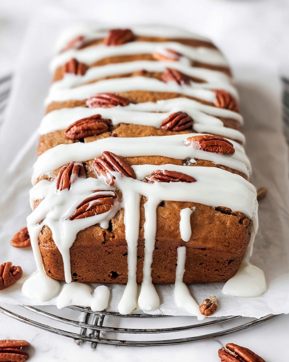 A rectangular brown cake with a slightly rough texture is topped with thick, white icing drizzled in five uneven horizontal lines across the surface. Scattered on top and slightly pressed into the icing are whole and broken pecan halves, adding a rich brown contrast. The cake sits on a white parchment paper over a metal cooling rack, all placed on a white marbled texture. Photo taken with an iphone --ar 4:5 --v 7