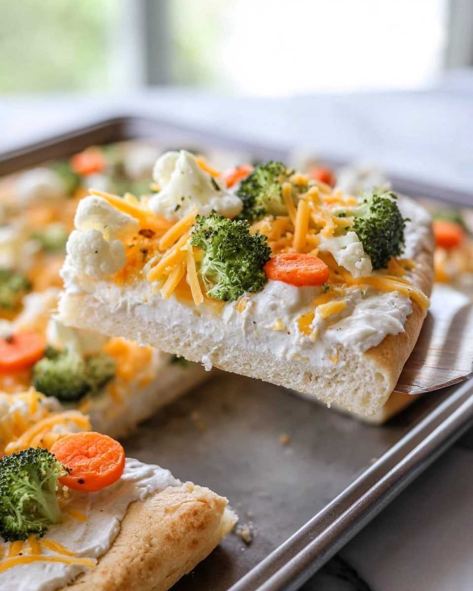 A slice of soft, thick pizza crust with a light golden brown color forms the bottom layer, topped with a smooth, white creamy sauce spread evenly on top. On top of the sauce, small pieces of bright green broccoli florets, white cauliflower chunks, and vibrant orange carrot slices are scattered, with thin strands of shredded orange cheddar cheese adding color and texture. The slice is being lifted from a metal baking tray showing more similar slices underneath, on a white marbled surface in soft natural light. photo taken with an iphone --ar 4:5 --v 7